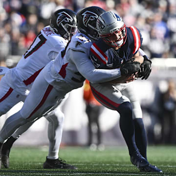 Nov 2, 2025; Foxborough, Massachusetts, USA; Atlanta Falcons defensive tackle Brandon Dorlus (54) sacks New England Patriots quarterback Drake Maye (10) during the first half at Gillette Stadium. Mandatory Credit: Brian Fluharty-Imagn Images