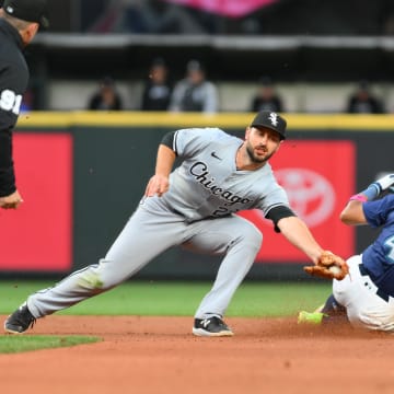 Chicago White Sox shortstop Paul DeJong (29) misses the tag on Seattle Mariners center fielder Julio Rodriguez (44) for a stolen base during the fifth inning at T-Mobile Park in June.