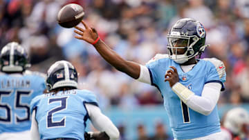 Tennessee Titans quarterback Cam Ward (1) throws for a first down against the New England Patriots during the first quarter at Nissan Stadium in Nashville, Tenn., Sunday, Oct. 19, 2025.