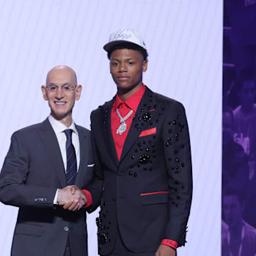 Jun 25, 2025; Brooklyn, NY, USA;  Ace Bailey stands with NBA commissioner Adam Silver after being selected as the fifth pick by the Utah Jazz in the first round of the 2025 NBA Draft at Barclays Center. Mandatory Credit: Brad Penner-Imagn Images