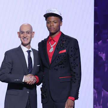 Jun 25, 2025; Brooklyn, NY, USA;  Ace Bailey stands with NBA commissioner Adam Silver after being selected as the fifth pick by the Utah Jazz in the first round of the 2025 NBA Draft at Barclays Center. Mandatory Credit: Brad Penner-Imagn Images