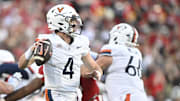 Oct 4, 2025; Louisville, Kentucky, USA; Virginia Cavaliers quarterback Chandler Morris (4) looks to pass against the Louisville Cardinals during the second half at L&N Federal Credit Union Stadium. Virginia defeated Louisville 30-27. Mandatory Credit: Jamie Rhodes-Imagn Images