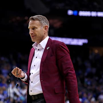 Mar 29, 2025; Newark, NJ, USA; Alabama Crimson Tide head coach Nate Oats brings a referee a whistle during the second half against the Duke Blue Devilsin the East Regional final of the 2025 NCAA tournament at Prudential Center. Mandatory Credit: Vincent Carchietta-Imagn Images