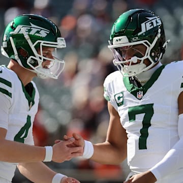Oct 26, 2025; Cincinnati, Ohio, USA; New York Jets quarterback Brady Cook (4) high fives quarterback Justin Fields (7) before the game against the Cincinnati Bengals at Paycor Stadium. Mandatory Credit: Joseph Maiorana-Imagn Images