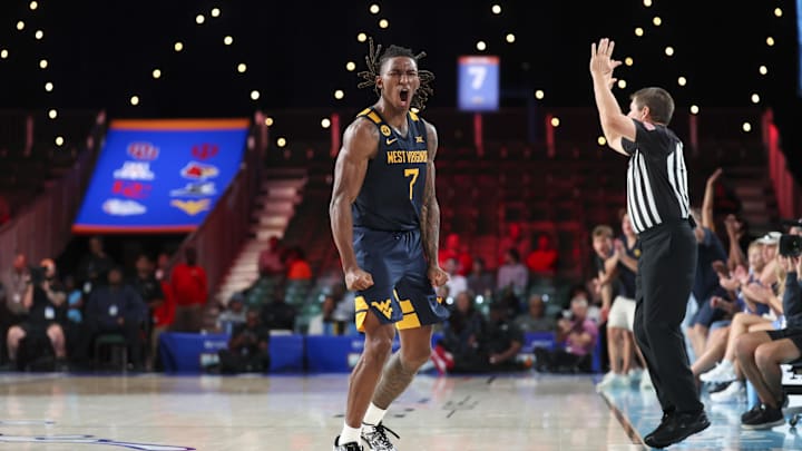 Nov 28, 2024; Paradise Island, Bahamas, BHS;  West Virginia Mountaineers guard Javon Small (7) reacts after scoring during the second half against the Louisville Cardinals at Imperial Arena at the Atlantis resort.  Mandatory Credit: Kevin Jairaj-Imagn Images