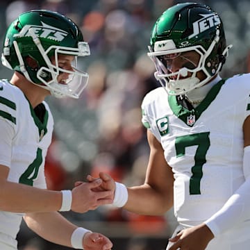 Oct 26, 2025; Cincinnati, Ohio, USA; New York Jets quarterback Brady Cook (4) high fives quarterback Justin Fields (7) before the game against the Cincinnati Bengals at Paycor Stadium. Mandatory Credit: Joseph Maiorana-Imagn Images