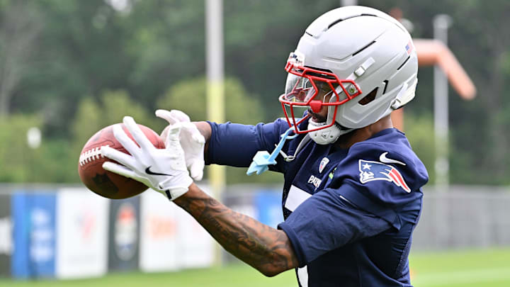 Jun 9, 2025; Foxborough, MA, USA; New England Patriots cornerback Carlton Davis III (7) makes a catch during minicamp at Gillette Stadium. Mandatory Credit: Eric Canha-Imagn Images