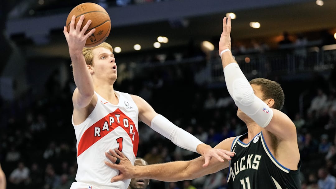 Nov 12, 2024; Milwaukee, Wisconsin, USA; Toronto Raptors guard Gradey Dick (1) shoots against Milwaukee Bucks center Brook Lopez (11) during the first quarter at Fiserv Forum. Mandatory Credit: Jeff Hanisch-Imagn Images Nov 12, 2024; Milwaukee, Wisconsin, USA; Toronto Raptors guard Gradey Dick (1) shoots against Milwaukee Bucks center Brook Lopez (11) during the first quarter at Fiserv Forum. Mandatory Credit: Jeff Hanisch-Imagn Images