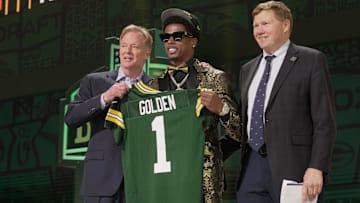 Wide receiver Matthew Golden of Texas poses with NFL Commissioner Roger Goodell and Green Bay Packers President and CEO Mark Murphy after being selected by the Green Bay Packers during the first round of the 2025 NFL Draft at Lambeau Field on April 24, 2025, in Green Bay.