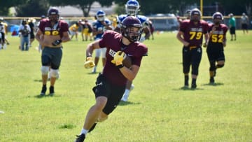 Moses Lake's Carter Anderson scores a touchdown at the Thurston County Team Camp at Tumwater.