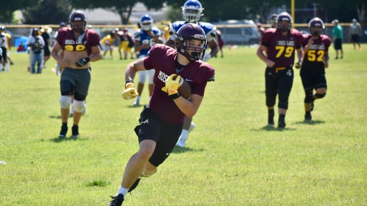 Moses Lake's Carter Anderson scores a touchdown at the Thurston County Team Camp at Tumwater.