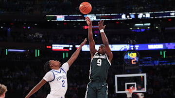 Nov 18, 2025; New York, New York, USA; Michigan State Spartans guard Trey Fort (9) shoots the ball as Kentucky Wildcats guard Jasper Johnson (2) defends during the first half at Madison Square Garden. Mandatory Credit: Vincent Carchietta-Imagn Images