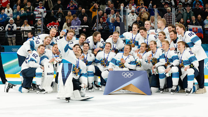 Feb 21, 2026; Milan, Italy; Finland pose for a photo with their bronze medals after the men's ice hockey bronze medal game during the Milano Cortina 2026 Olympic Winter Games at Milano Santagiulia Ice Hockey Arena. Mandatory Credit: Geoff Burke-Imagn Images