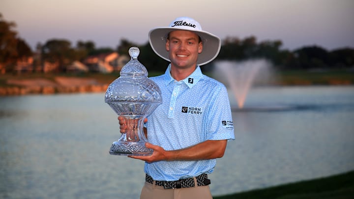 Joe Highsmith poses with the winner's trophy following his victory at the PGA Tour Cognizant Classic