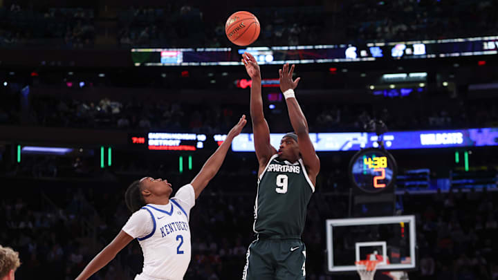 Nov 18, 2025; New York, New York, USA; Michigan State Spartans guard Trey Fort (9) shoots the ball as Kentucky Wildcats guard Jasper Johnson (2) defends during the first half at Madison Square Garden. Mandatory Credit: Vincent Carchietta-Imagn Images