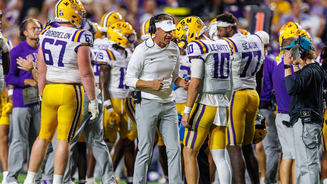 Sep 5, 2026; Baton Rouge, Louisiana, USA;  LSU Tigers head coach Lane Kiffin talks to quarterback Sam Leavitt (10) against Clemson Tigers during the first half at Tiger Stadium.  Mandatory Credit: Stephen Lew-Imagn Images