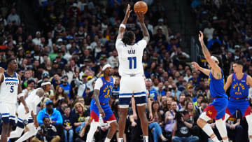 May 4, 2024; Denver, Colorado, USA; Minnesota Timberwolves center Naz Reid (11) shoots the ball against the Denver Nuggets in the playoffs. 