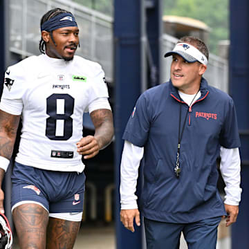 Jun 9, 2025; Foxborough, MA, USA; New England Patriots wide receiver Stefon Diggs (8) and offensive coordinator Josh McDaniels walk to the practice fields at Gillette Stadium. Mandatory Credit: Eric Canha-Imagn Images