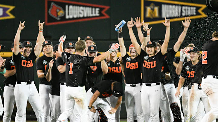 Jun 13, 2025; Omaha, Neb, USA; Oregon State Beavers left fielder Gavin Turley (1) celebrates with teammates after driving in the winning run against the Louisville Cardinals during the ninth inning at Charles Schwab Field. Mandatory Credit: Steven Branscombe-Imagn Images Jun 13, 2025; Omaha, Neb, USA; Oregon State Beavers left fielder Gavin Turley (1) celebrates with teammates after driving in the winning run against the Louisville Cardinals during the ninth inning at Charles Schwab Field. Mandatory Credit: Steven Branscombe-Imagn Images