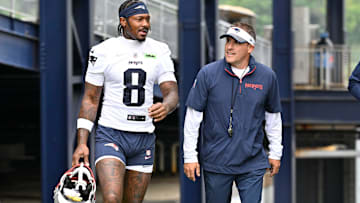 Jun 9, 2025; Foxborough, MA, USA; New England Patriots wide receiver Stefon Diggs (8) and offensive coordinator Josh McDaniels walk to the practice fields at Gillette Stadium. Mandatory Credit: Eric Canha-Imagn Images