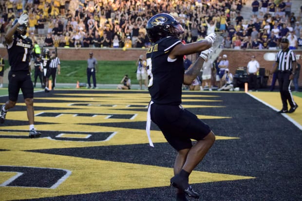 Missouri Tigers receiver Luther Burden III (3) celebrates in the end zone after scoring a touchdown. 