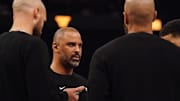 Nov 26, 2025; San Francisco, California, USA;  Houston Rockets head coach Ime Udoka talks with coaches during a timeout against the Golden State Warriors in the second quarter at Chase Center. Mandatory Credit: David Gonzales-Imagn Images