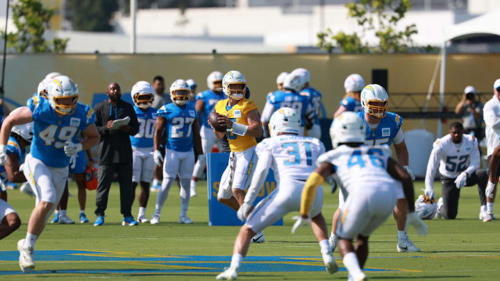 Jul 24, 2024; El Segundo, CA, USA;  Los Angeles Chargers quarterback Justin Herbert (10) looks to pass during the first day of training camp at The Bolt. Mandatory Credit: Kiyoshi Mio-USA TODAY Sports