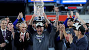 Oct 31, 2024; New York, New York, USA; Los Angeles Dodgers president and CEO Stan Kasten celebrates with the Commissioner’s Trophy after the Los Angeles Dodgers beat the New York Yankees in game four to win the 2024 MLB World Series at Yankee Stadium. Mandatory Credit: Brad Penner-Imagn Images