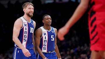 Apr 14, 2024; Sacramento, California, USA; Sacramento Kings forward Domantas Sabonis (10) and guard De'Aaron Fox (5) walk on the court during a break in the action against the Portland Trail Blazers in the third quarter at the Golden 1 Center. Mandatory Credit: Cary Edmondson-Imagn Images