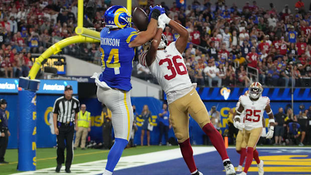 Los Angeles Rams tight end Colby Parkinson (84) attempts to make a catch over San Francisco 49ers safety Marques Sigle (36)