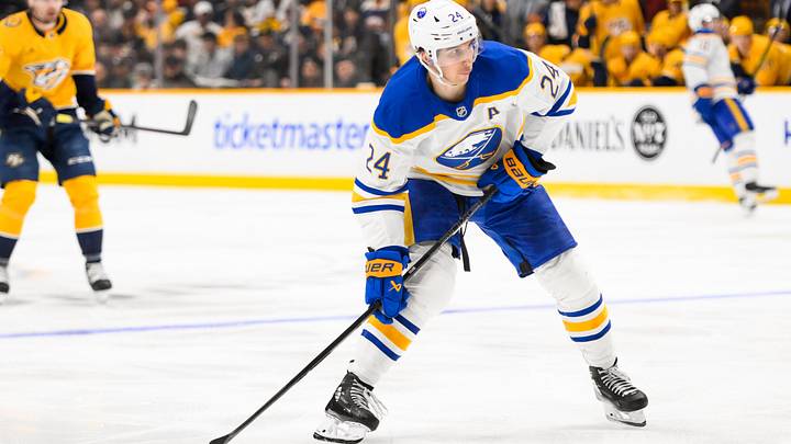 Feb 8, 2025; Nashville, Tennessee, USA;  Buffalo Sabres center Dylan Cozens (24) takes a shot on goal during the second period at Bridgestone Arena. Mandatory Credit: Steve Roberts-Imagn Images