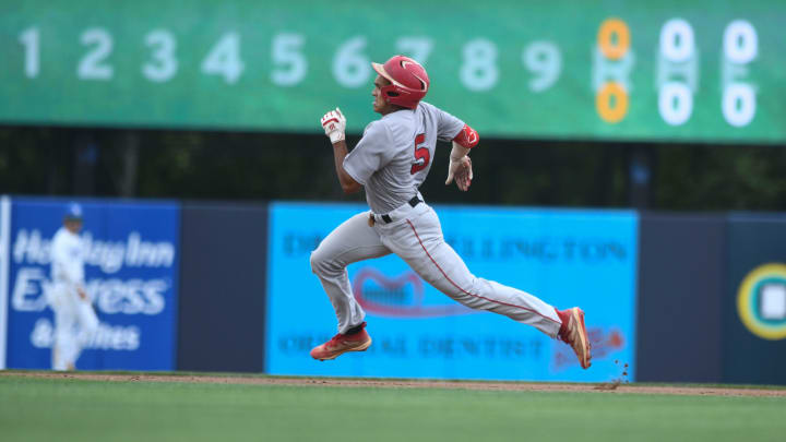 Harlem shortstop Tryston McCladdie (5) rounds second base at the Harlem and Ringgold AAA baseball championship game at AdventHealth Stadium in Rome, Ga., on Friday, May 19, 2023. Harlem won the first game with a score of 5-3.