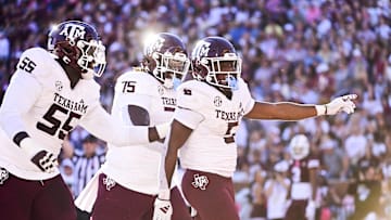 Oct 19, 2024; Starkville, Mississippi, USA;Texas A&M Aggies running back Amari Daniels (5) celebrates with teammates after a touchdown against the Mississippi State Bulldogs during the second quarter at Davis Wade Stadium at Scott Field. Mandatory Credit: Matt Bush-Imagn Images