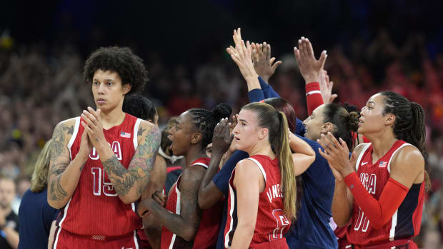 United States centre Brittney Griner (15) celebrates with guard Jewell Loyd (4) and guard Sabrina Ionescu (6)