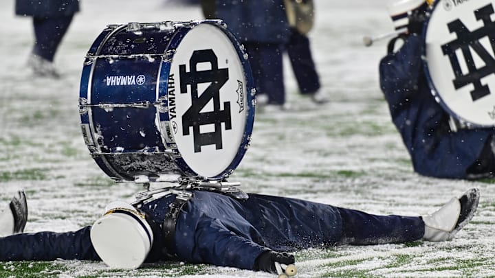 Nov 19, 2022; South Bend, Indiana, USA; Members of the Notre Dame Marching Band make snow angels following the game between the Notre Dame Fighting Irish and the Boston College Eagles at Notre Dame Stadium. Nov 19, 2022; South Bend, Indiana, USA; Members of the Notre Dame Marching Band make snow angels following the game between the Notre Dame Fighting Irish and the Boston College Eagles at Notre Dame Stadium.