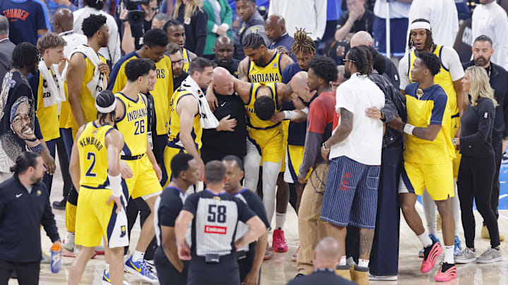 Indiana Pacers guard Tyrese Haliburton is assisted after an apparent injury following a play against the Oklahoma City Thunder during the first half of game seven of the 2025 NBA Finals at Paycom Center. 