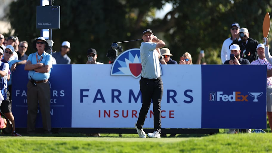 Justin Rose plays his shot from the 18th tee during the final round of the 2026 Farmers Insurance Open. 