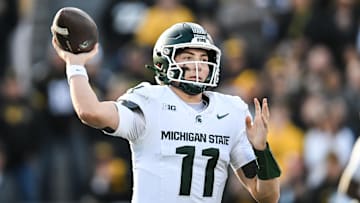 Nov 22, 2025; Iowa City, Iowa, USA; Michigan State Spartans quarterback Alessio Milivojevic (11) throws a pass against the Iowa Hawkeyes during the first quarter at Kinnick Stadium.