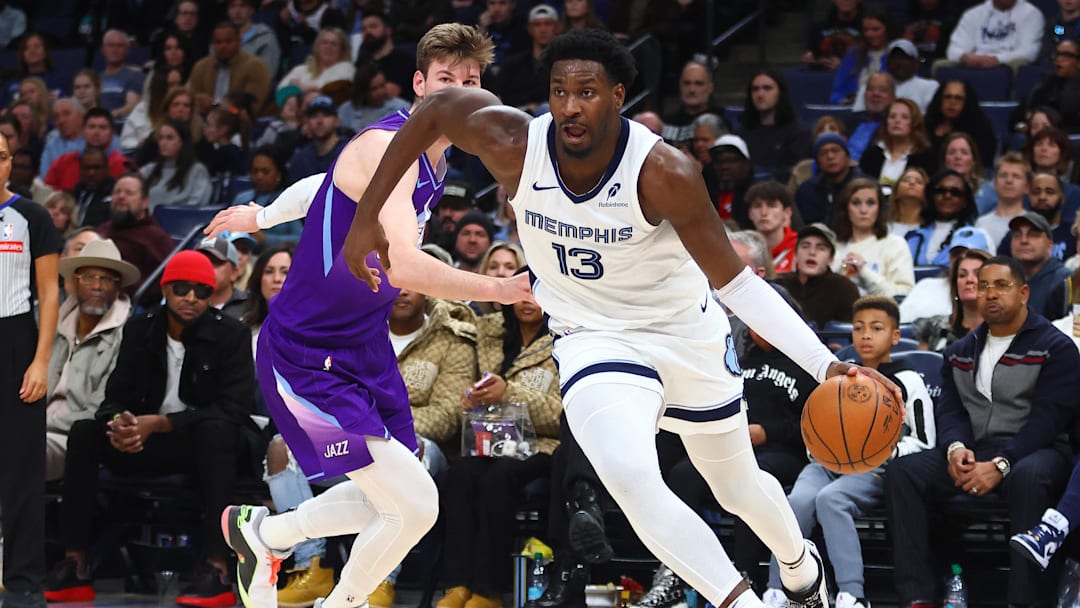 Jan 25, 2025; Memphis, Tennessee, USA; Memphis Grizzlies forward Jaren Jackson Jr. (13) drives to the basket against Utah Jazz forward Kyle Filipowski (22) during the second quarter at FedExForum. Mandatory Credit: Petre Thomas-Imagn Images