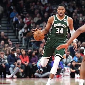 Jan 6, 2025; Toronto, Ontario, CAN;Milwaukee Bucks forward Giannis Antetokounmpo (34) dribbles the ball as Toronto Raptors forward Scottie Barnes (4) defends during the second quarter at Scotiabank Arena. Mandatory Credit: Nick Turchiaro-Imagn Images