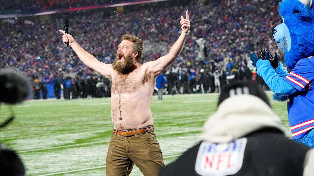 Jan 19, 2025; Orchard Park, New York, USA; Former Buffalo Bills quarterback Ryan Fitzpatrick rallies the crowd before the game against the Baltimore Ravens in a 2025 AFC divisional round game at Highmark Stadium