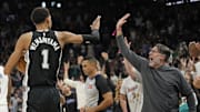Mar 29, 2024; San Antonio, Texas, USA; San Antonio Spurs forward Victor Wembanyama (1) and a fan react after an overtime victory over the New York Knicks at Frost Bank Center. Mandatory Credit: Scott Wachter-Imagn Images