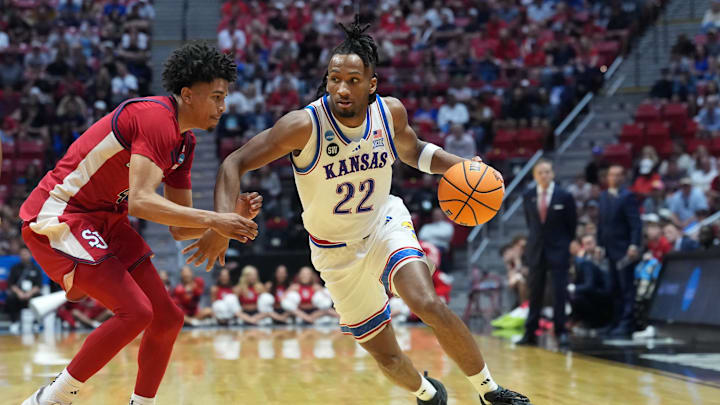 Mar 22, 2026; San Diego, CA, USA; Kansas Jayhawks guard Darryn Peterson (22) controls the ball against St. John's Red Storm guard Oziyah Sellers (4) in the second half during a second round game of the men's 2026 NCAA Tournament at Viejas Arena. Mandatory Credit: Kirby Lee-Imagn Images