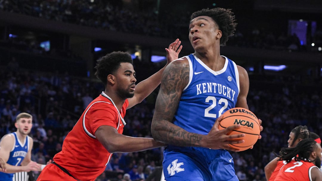 Dec 21, 2024; New York, New York, USA; Kentucky Wildcats center Amari Williams (22) posts up against Ohio State Buckeyes forward Sean Stewart (13) during the first half at Madison Square Garden. Mandatory Credit: John Jones-Imagn Images