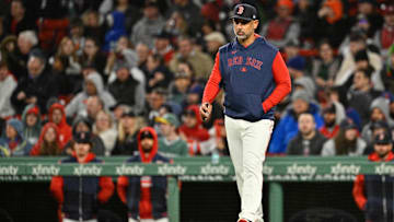 May 21, 2025; Boston, Massachusetts, USA; Boston Red Sox manager Alex Cora (13) walks to the mound during the sixth inning against the New York Mets at Fenway Park.