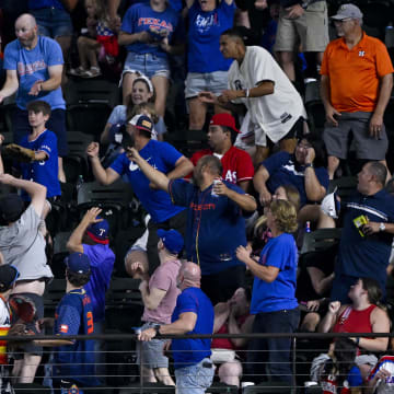 Aug 5, 2024; Arlington, Texas, USA; A view of the Texas Rangers fans as they battle for a home run ball hit by shortstop Corey Seager (not pictured) during the eighth inning against the Houston Astros at Globe Life Field. Mandatory Credit: Jerome Miron-USA TODAY Sports