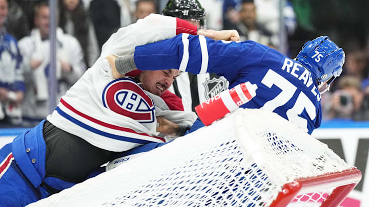 Oct 11, 2023; Toronto, Ontario, CAN; Toronto Maple Leafs right wing Ryan Reaves (75) fights with Montreal Canadiens defenseman Arber Xhekaj (72) during the first period at Scotiabank Arena. Mandatory Credit: Nick Turchiaro-Imagn Images