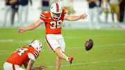 Aug 31, 2025; Miami Gardens, Florida, USA; Miami Hurricanes place kicker Carter Davis (39) kicks the game winning field goal against the Notre Dame Fighting Irish at Hard Rock Stadium. Mandatory Credit: Sam Navarro-Imagn Images