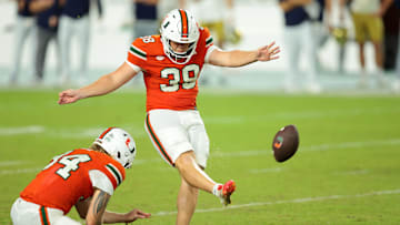 Aug 31, 2025; Miami Gardens, Florida, USA; Miami Hurricanes place kicker Carter Davis (39) kicks the game winning field goal against the Notre Dame Fighting Irish at Hard Rock Stadium. Mandatory Credit: Sam Navarro-Imagn Images