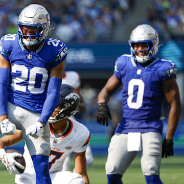 Sep 8, 2024; Seattle, Washington, USA; Seattle Seahawks safety Julian Love (20) celebrates after making a tackle against the Denver Broncos during the third quarter at Lumen Field. Mandatory Credit: Joe Nicholson-Imagn Images